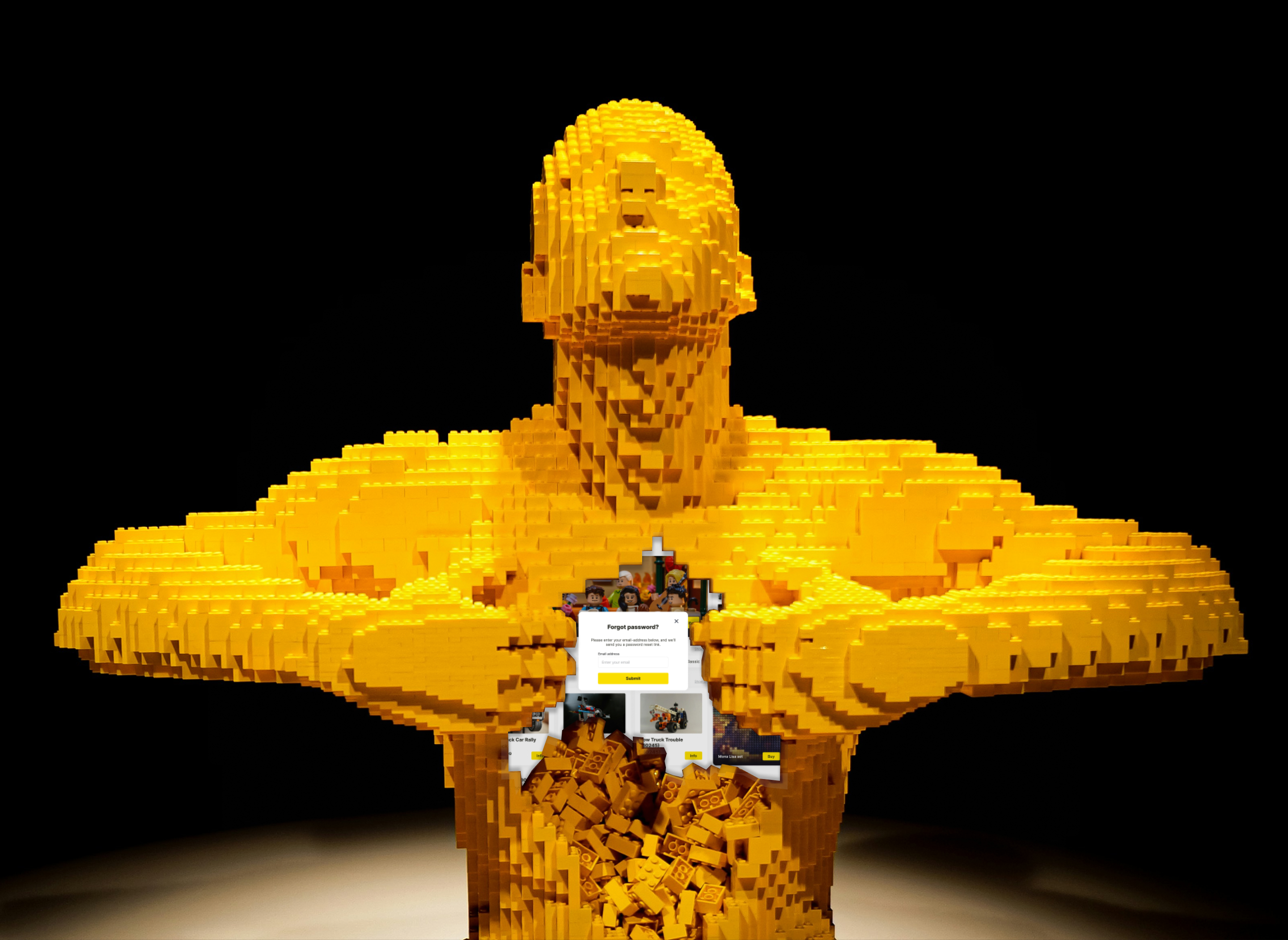 Yellow LEGO sculpture holding a phone